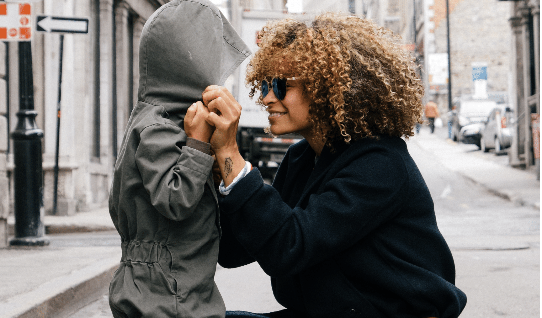 Mother and son holding hands on the pavement