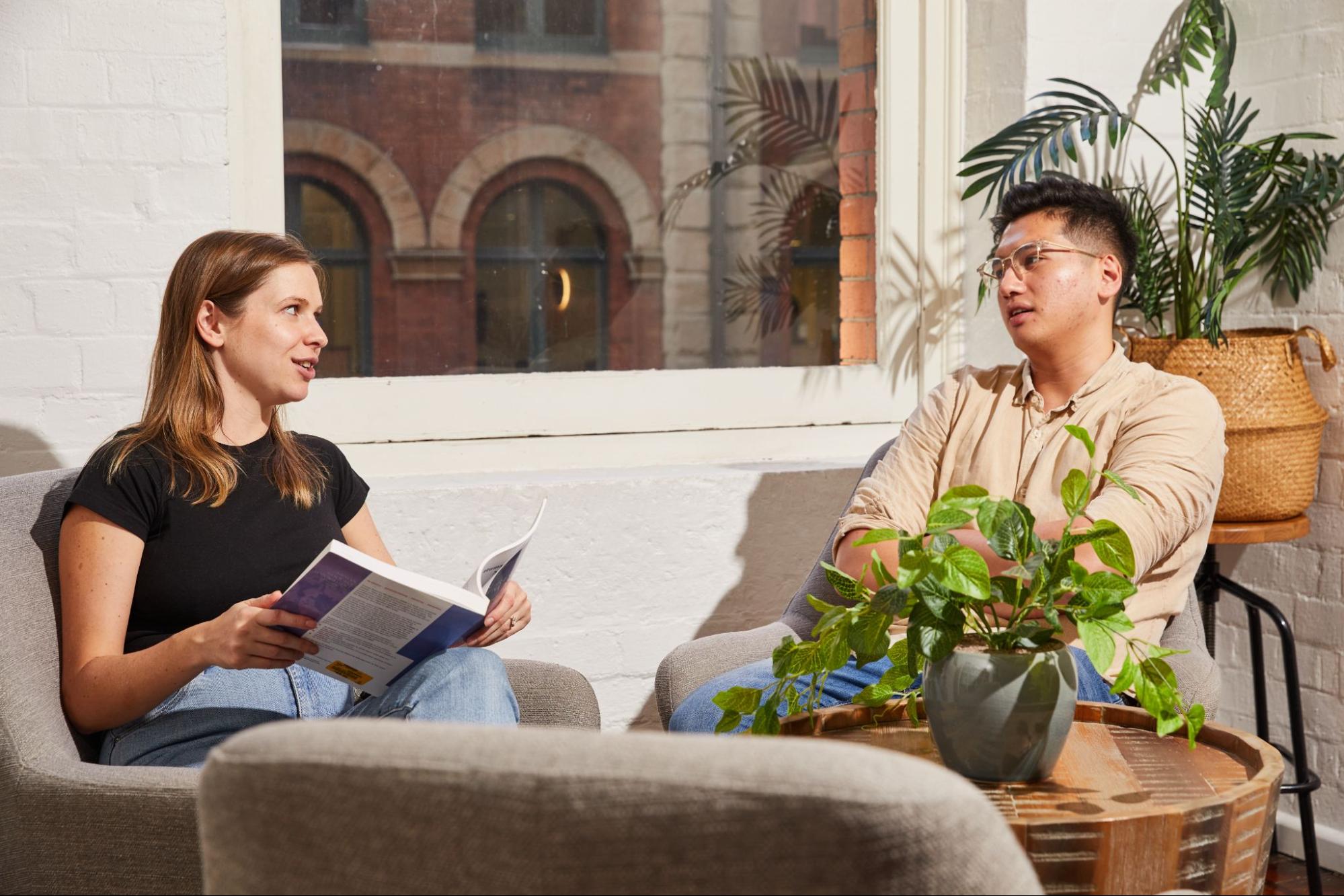 two colleagues chatting in the office