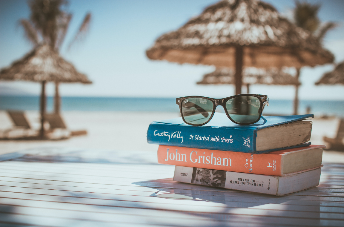 Pile of books on a beach