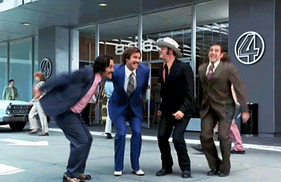 Anchorman jumping together in celebration