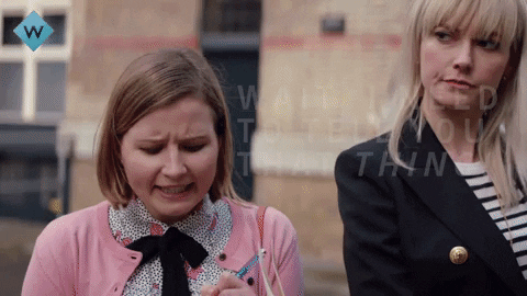 A girl in a pink cardigan shouts "wait, I need to tell you THAT thing" the other women answers "email me" while walking away 