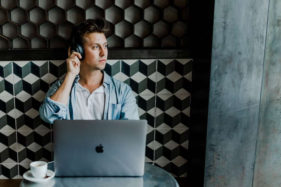 guy listening to music on headphones