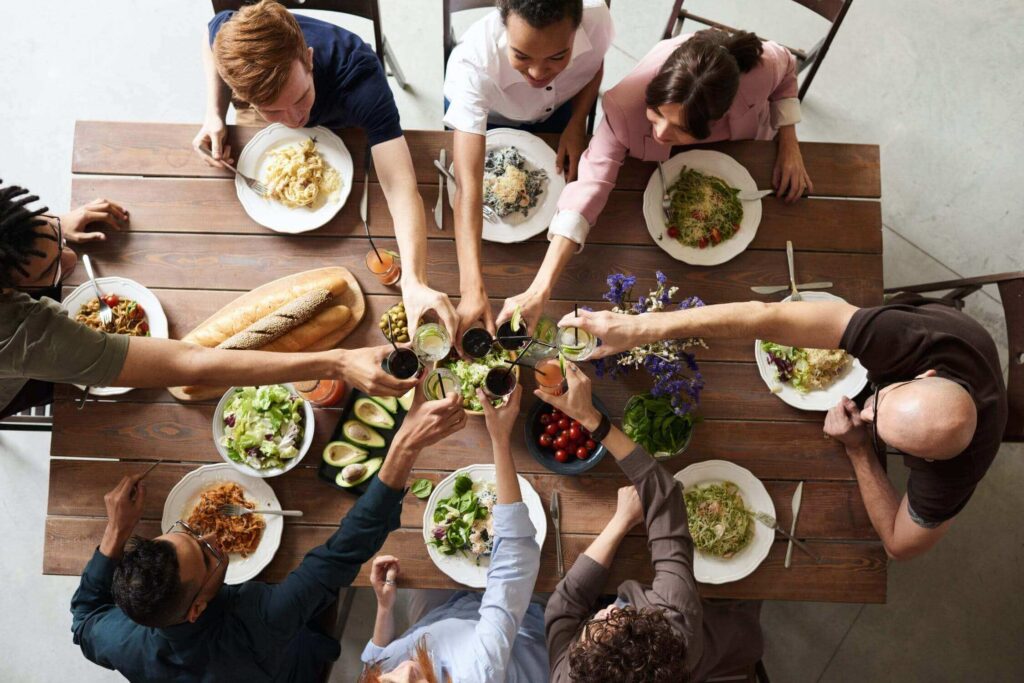 Image showing a group of friends making a toast during a meal together