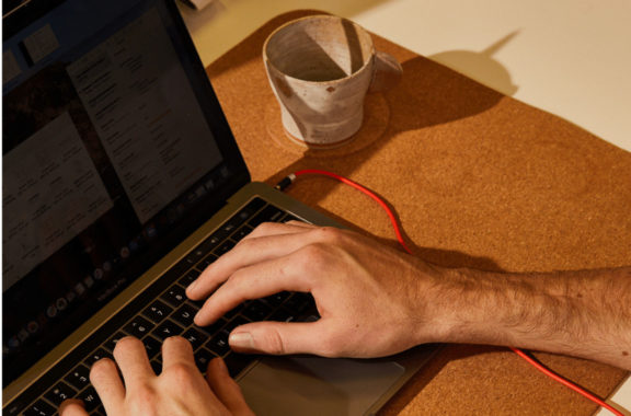 Employment Hero Demo - image of a man at a laptop