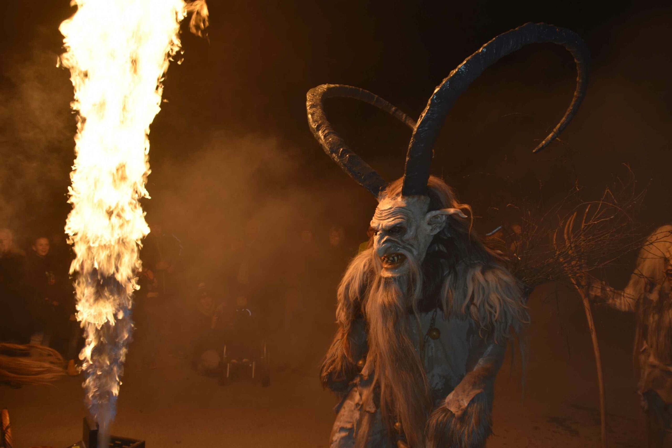 Krampus Christmas Devil Standing Next To Flame