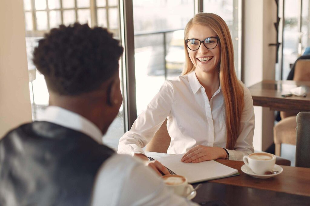 This image shows two happy people having a conversation