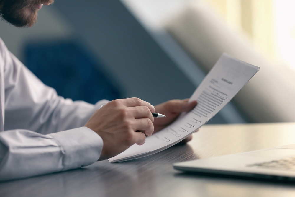 Office worker reviewing document