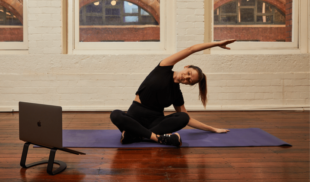 Woman stretching in an office