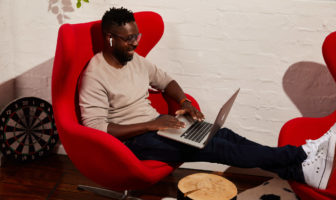 Man smiling while working because onboarding has never been easier