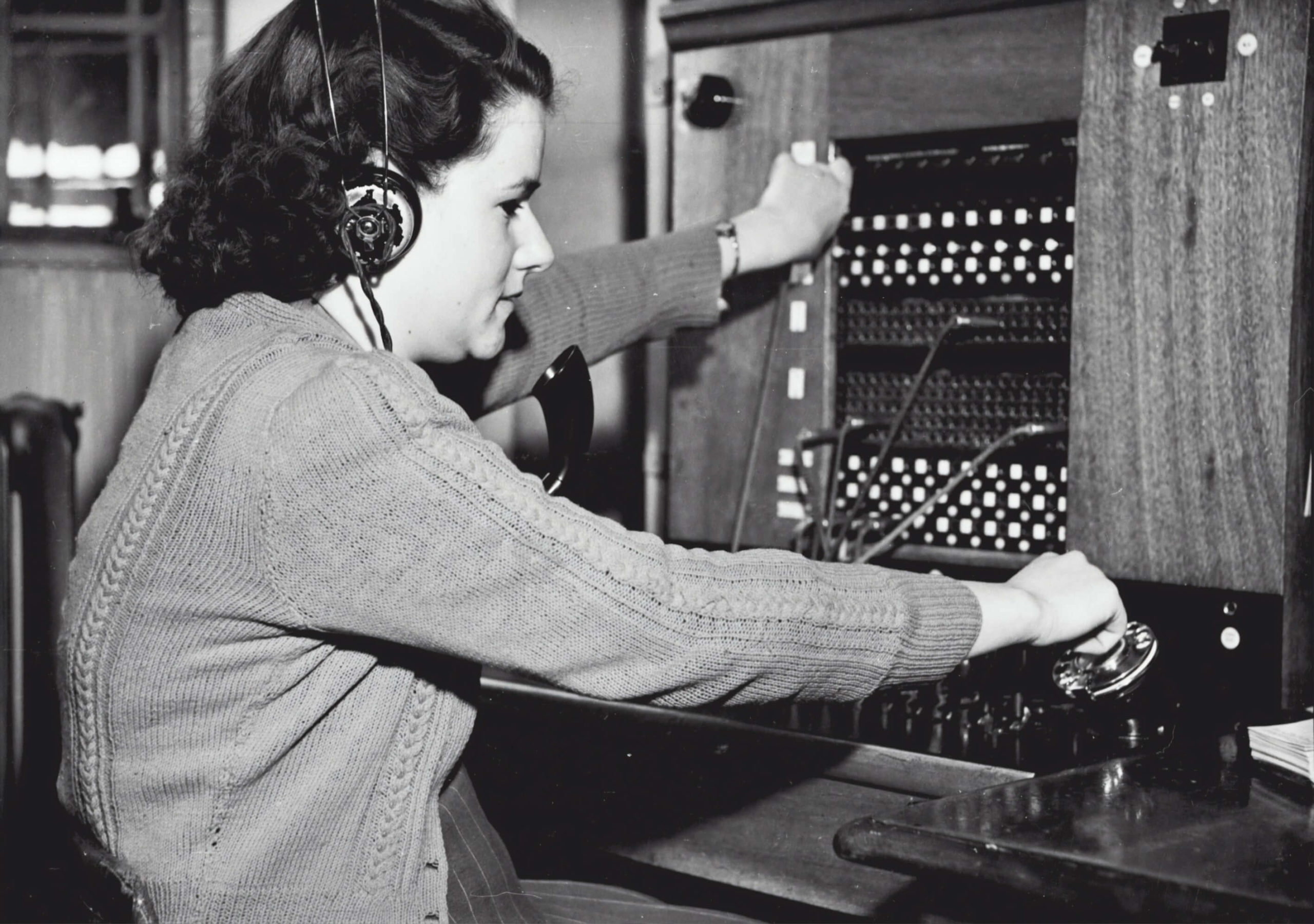 black and white photo of a telephone operator in the 1950s