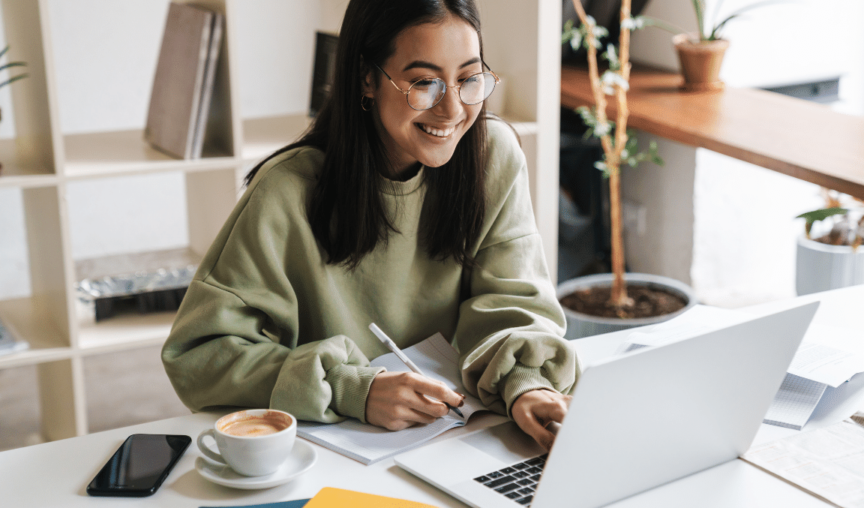 image of a woman at her laptop - Small Business Technology Investment Boost