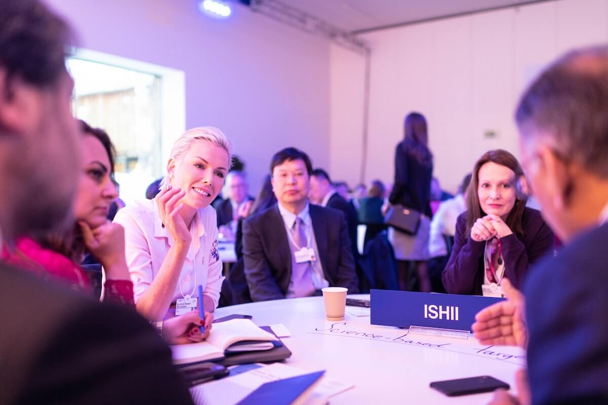 a group of business owners networking around a table