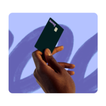 A close-up photo of a hand holding a black Swag card against a purple background