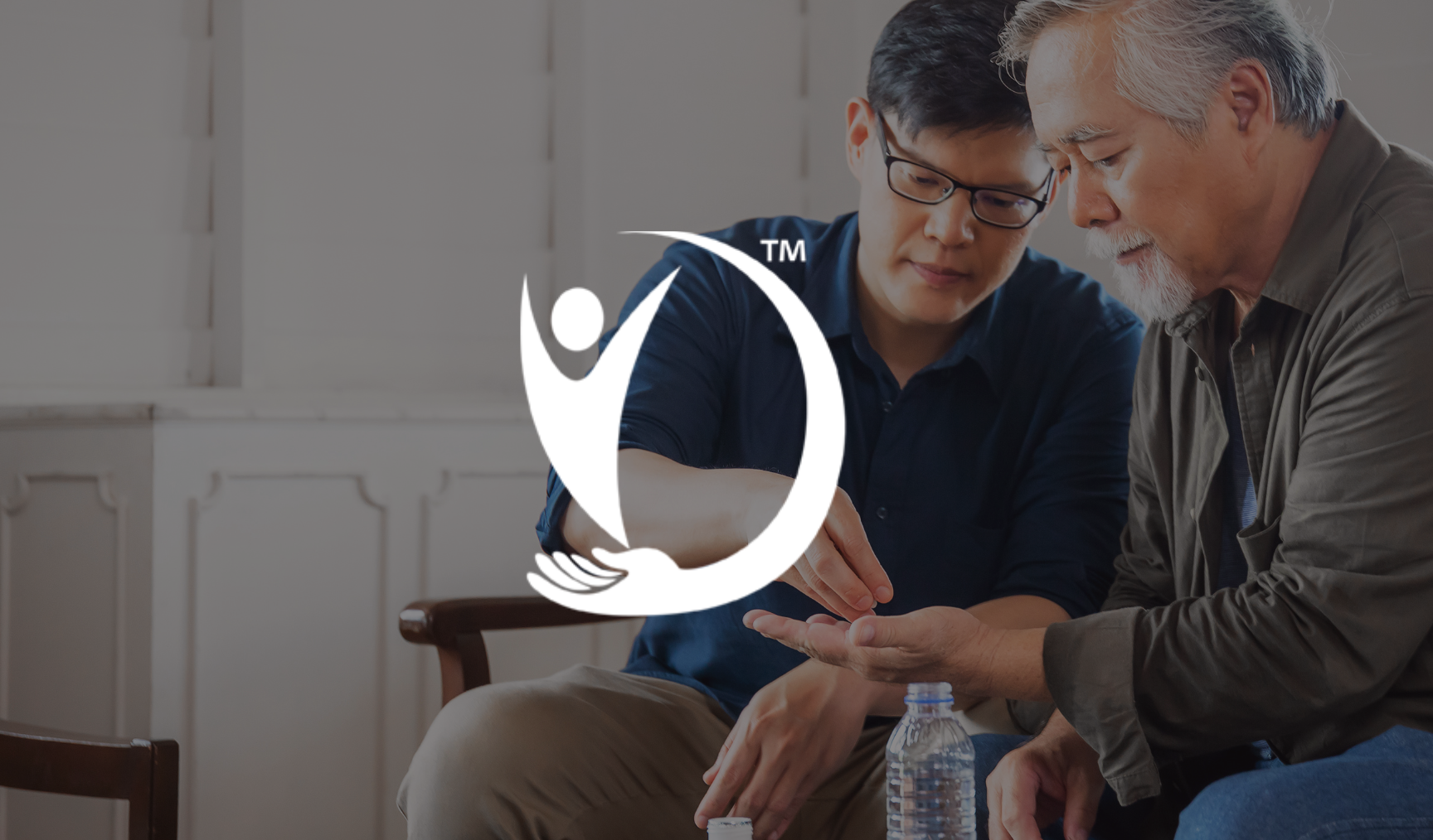 Tradern - image of a young man helping an older man