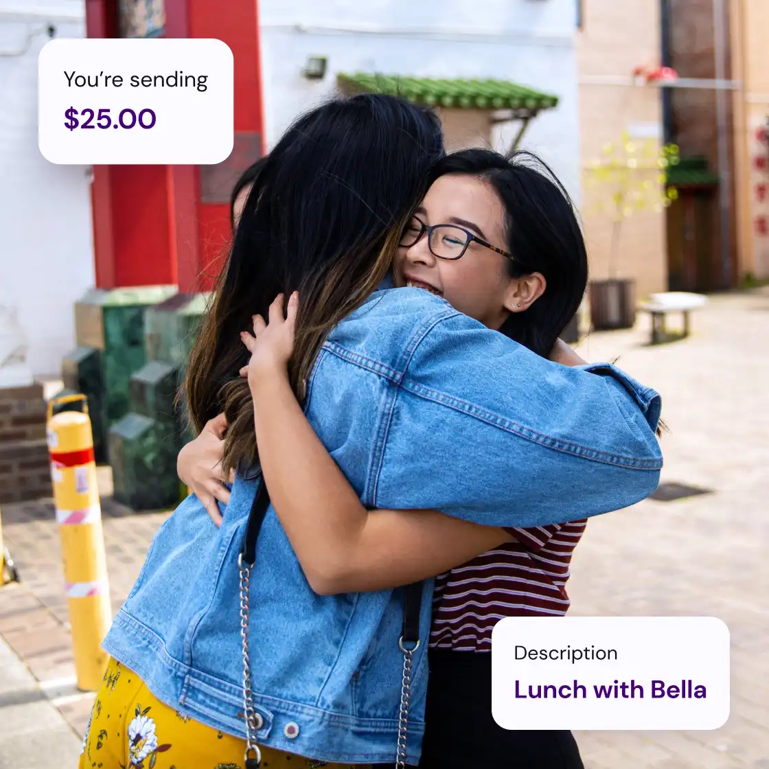 Two women embracing warmly outdoors, one in a denim jacket and the other in glasses, conveying a joyful reunion. Overlay text: “You’re sending $25.00” and “Lunch with Bella.”